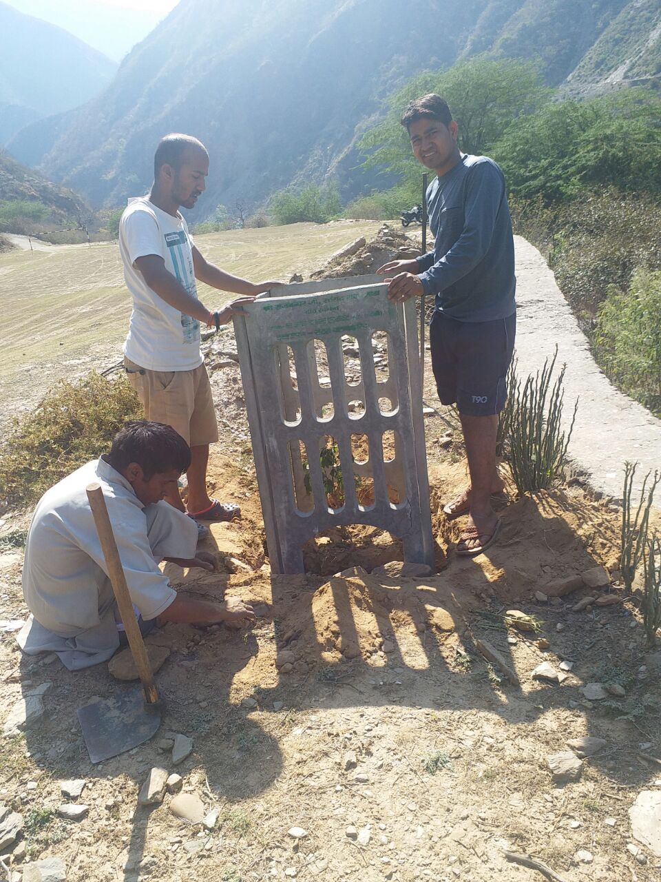  FIXING OF TREE GUARDS TO PROTECT THE YOUNG TREES 